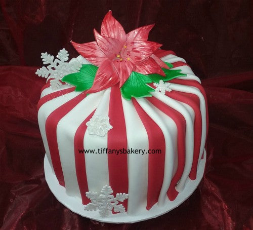 Christmas cake with red flowers. Christmas cake with red poinsettia flowers  and golden balls. | CanStock